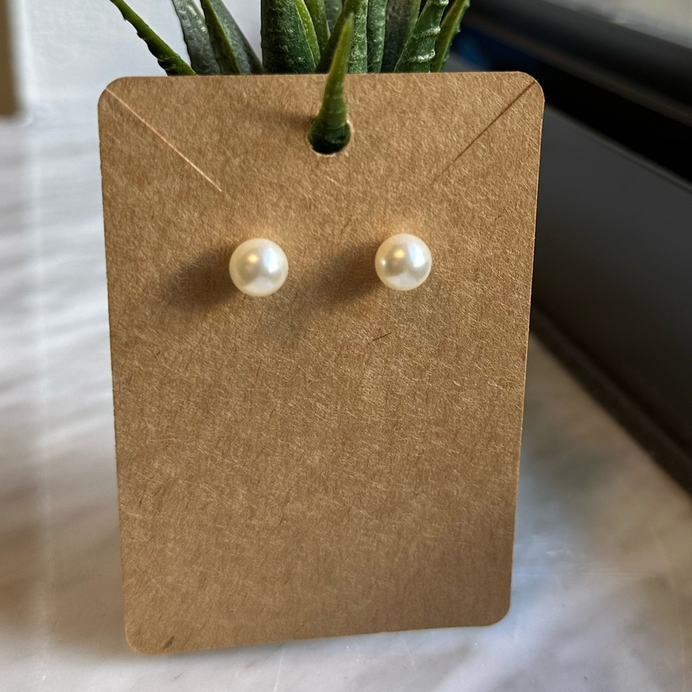 Pearl and heart shaped earrings